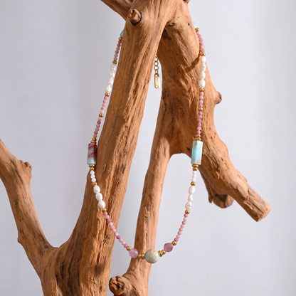 Isla Pearl Bead Necklace styled on a driftwood display