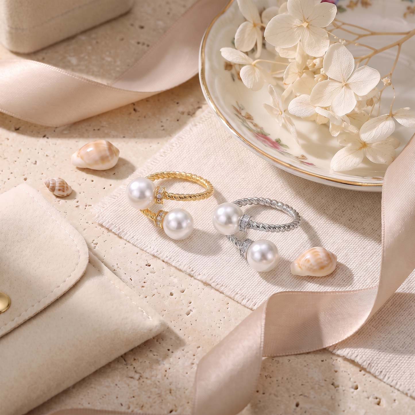 Maeve double pearl twist ring in gold and silver side by side