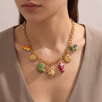 Maris-Charm-Cluster-Necklace Gold — on model