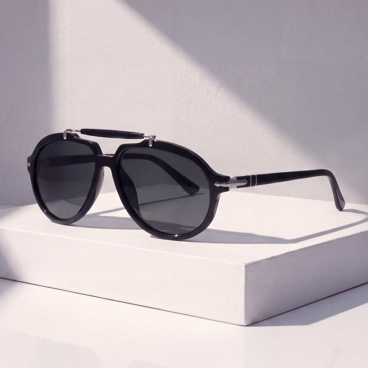 Monterey Pilot Sunglasses in Black on a white plinth