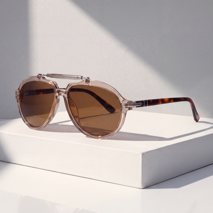 Monterey Pilot Sunglasses in Clear Tan on a white plinth