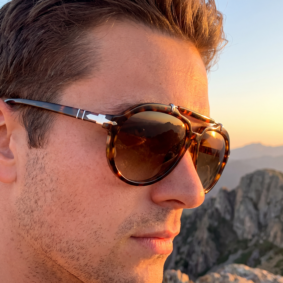 Side profile of a man wearing the Monterey Pilot Sunglasses in Tortoise at a mountain overlook