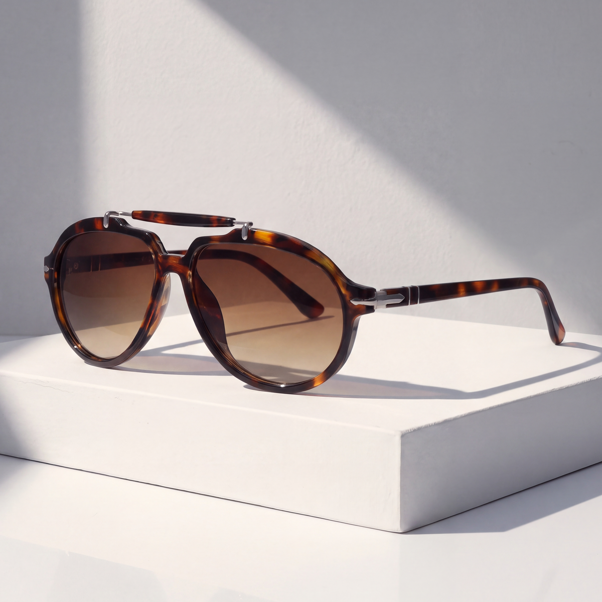 Monterey Pilot Sunglasses in Tortoise on a white plinth