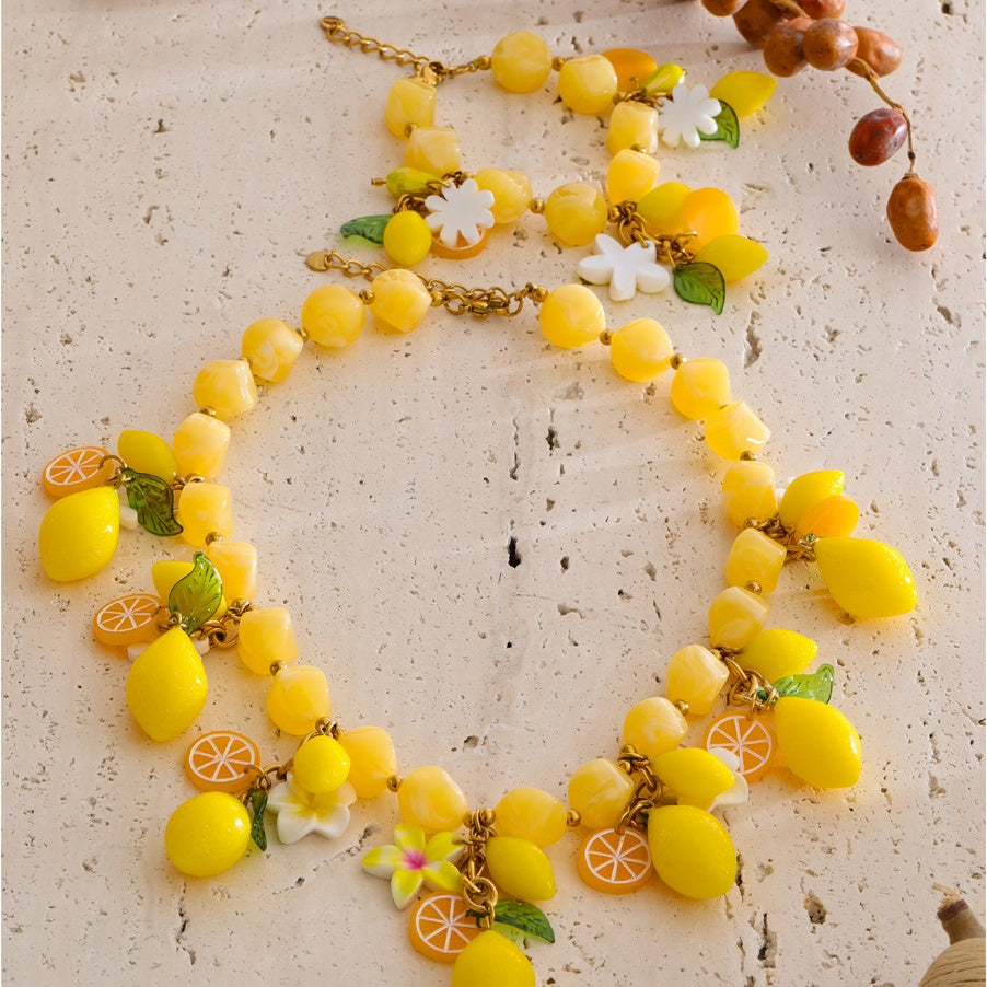 Renna Lemon Jewelry Set necklace and bracelet flat lay