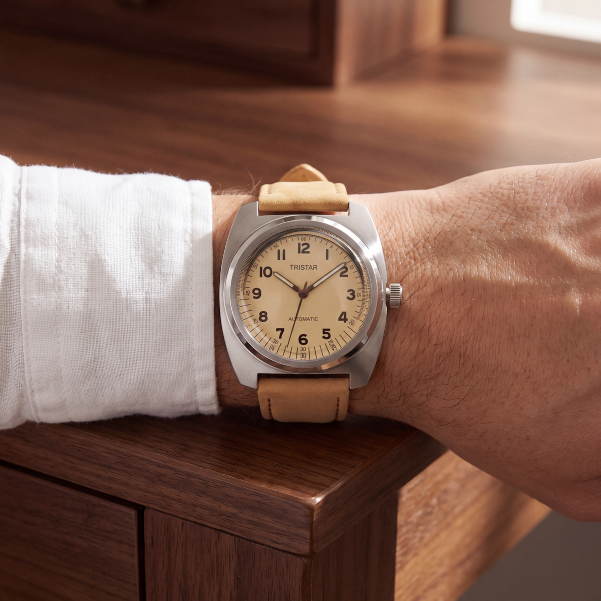 Rhodes Genuine Leather Watch worn on the wrist at a walnut desk