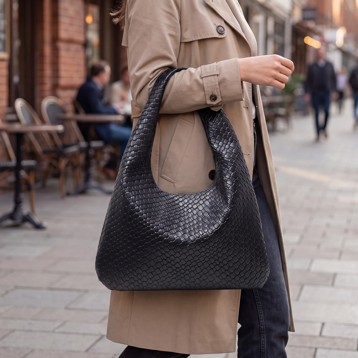 Seville Shoulder Bag in Black, worn on the shoulder