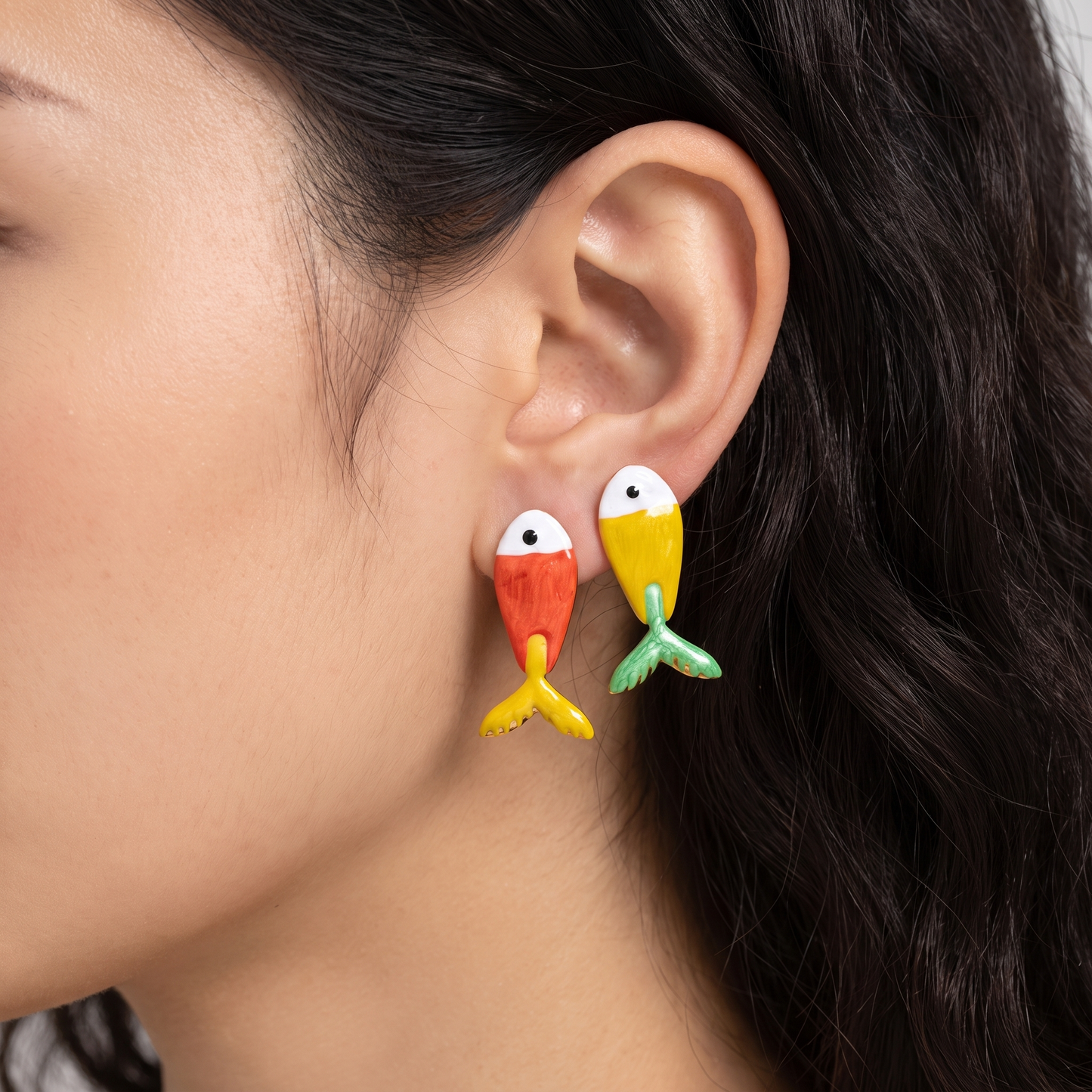 Sienna Enamel Fish Stud Earrings in Red & Yellow — worn on model