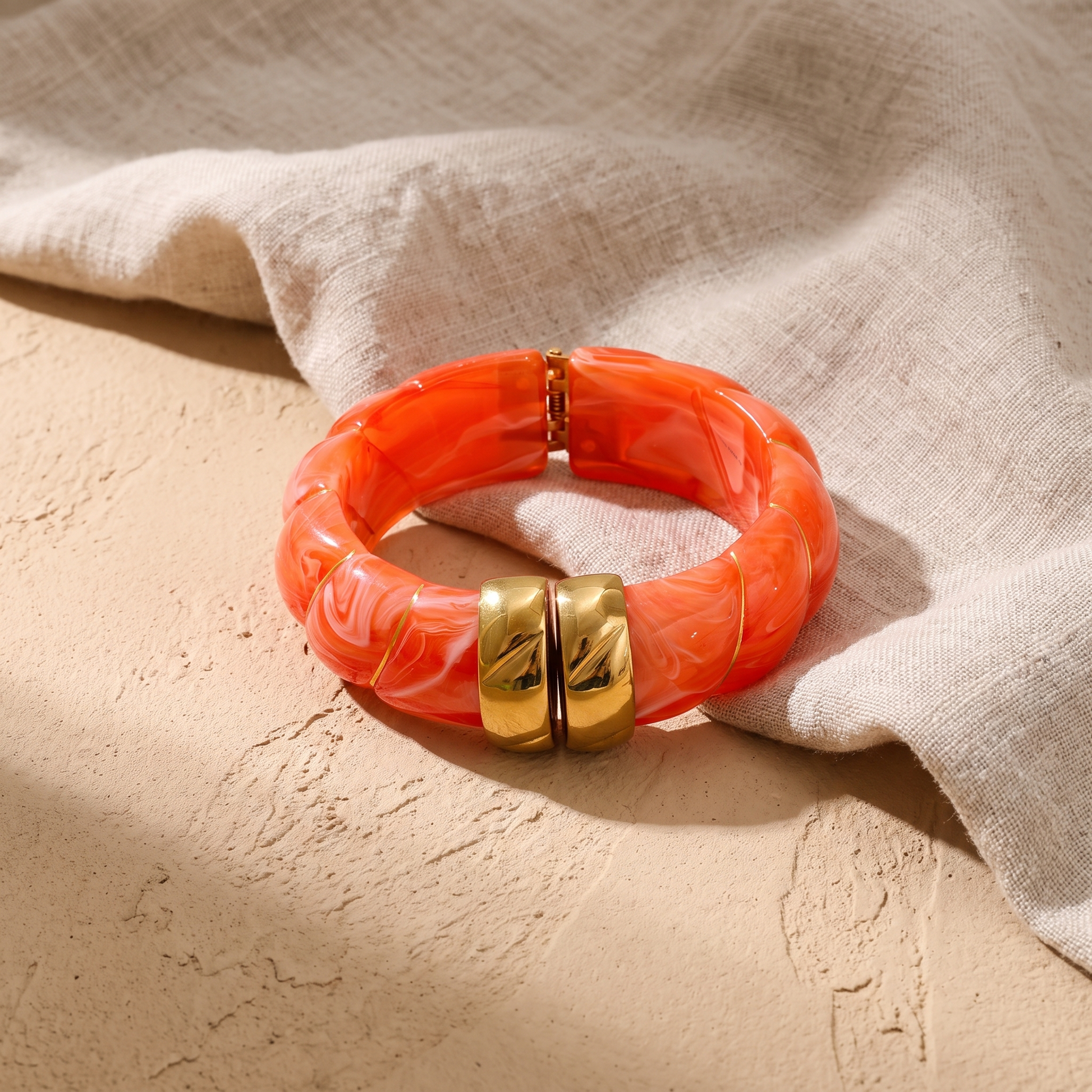 Sonoma resin cuff bangle in Coral with gold-tone rings