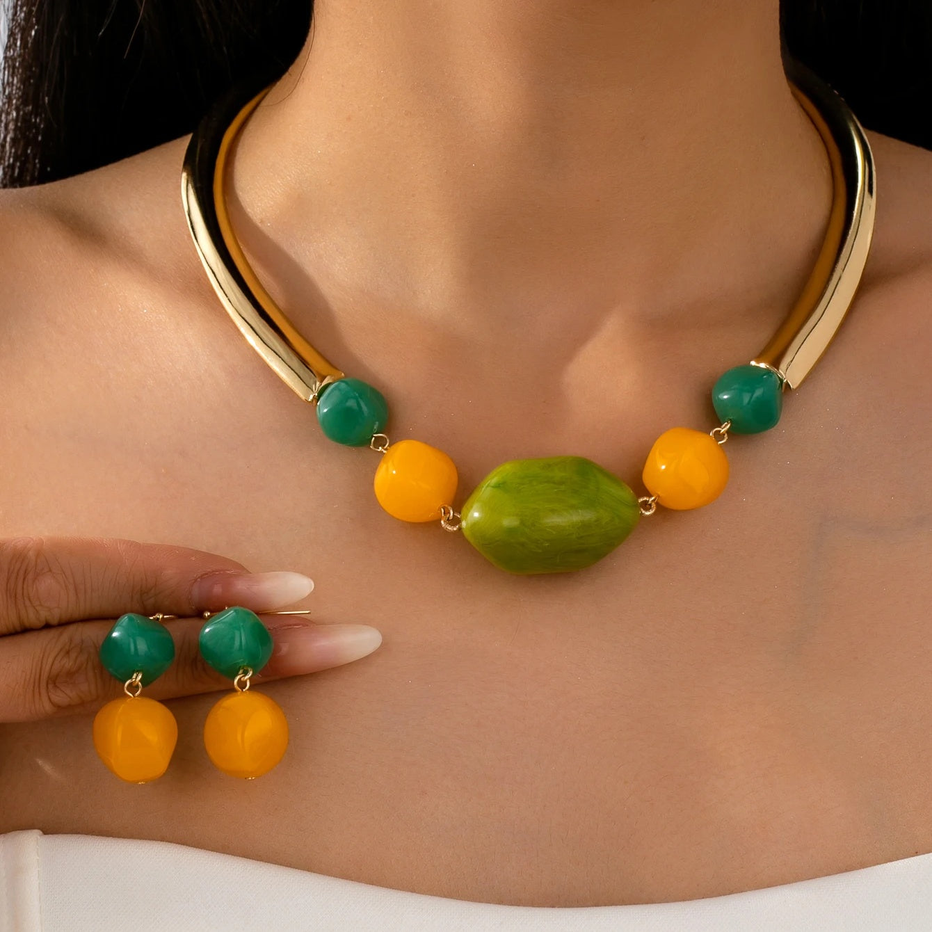 Sorrento gold collar necklace worn with matching drop earrings